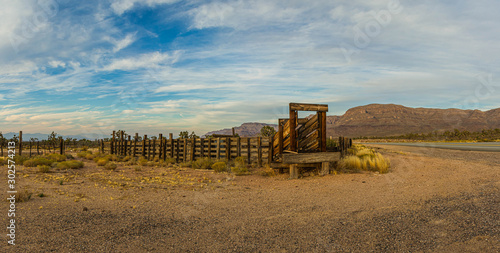 Panorama of an old western corral in the desert of Arizona in late afternoon light.