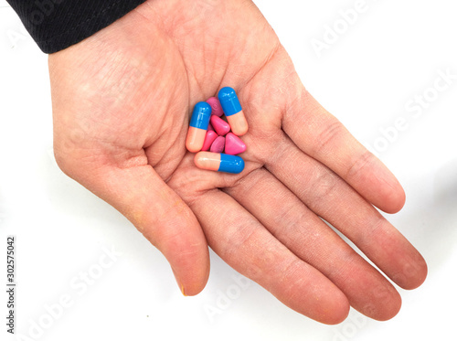 Hand holded drug medicines before take in oral in healthcare drug consumption concept