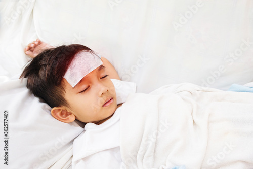 Asian boy is not comfortable.