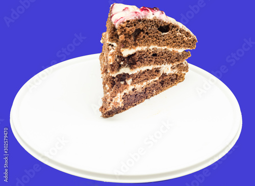 A slice of homemade cake on a cutting board