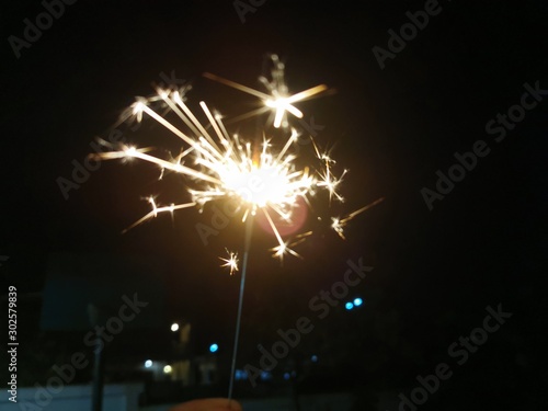 Sparks and lighting of fire crackers during loy krathong or diwali festival celebration.