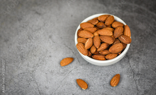 Almonds bowl on gray background / Close up almond nuts natural protein food and for snack