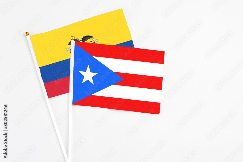 Puerto Rico and Ecuador stick flags on white background. High quality fabric, miniature national flag. Peaceful global concept.White floor for copy space. Puerto Rico and Ecuador stick flags on white background. High quality fabric, miniature national flag. Peaceful global concept.White floor for copy space.