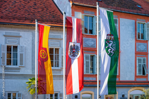 Flags of Austria and Styria and Bad Radkersburg with coat arms in vintage style. Royal red on white with eagle and green and white with dragon. Crest of Simple shape. Decorative frame. Crown heraldic photo