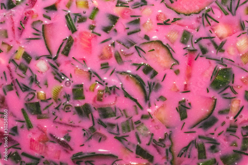 Cold beet soup close up. vegetable beetroot soup with cucumber and greens