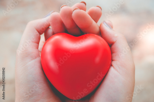 Woman hold red heart