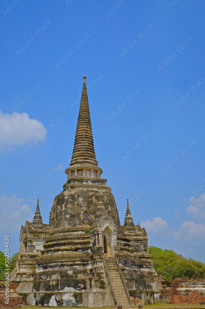 The ancient pagoda in Thailand with blue sky background