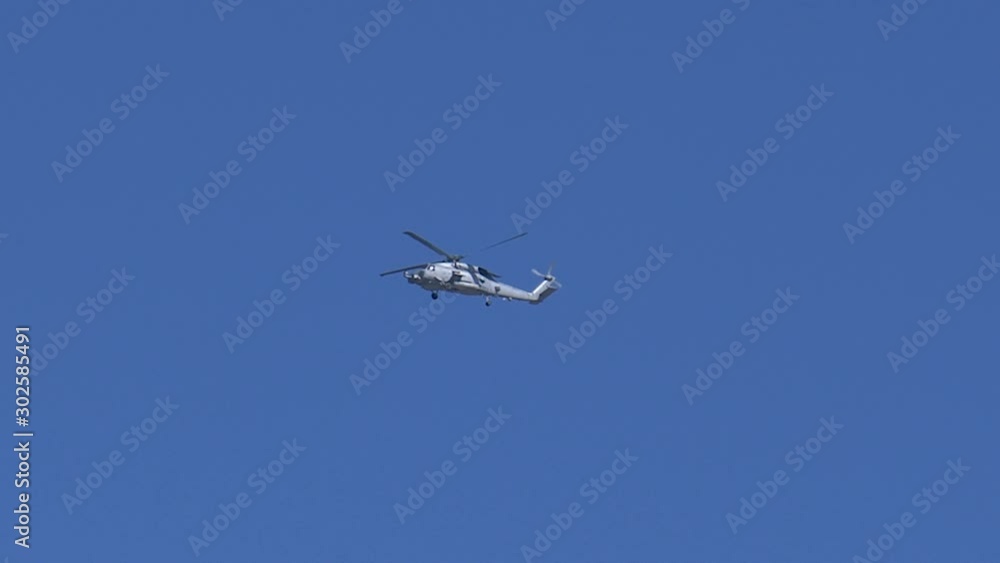 Japanese army combat helicopter flying in the sky Japanese army combat helicopter flying in the sky