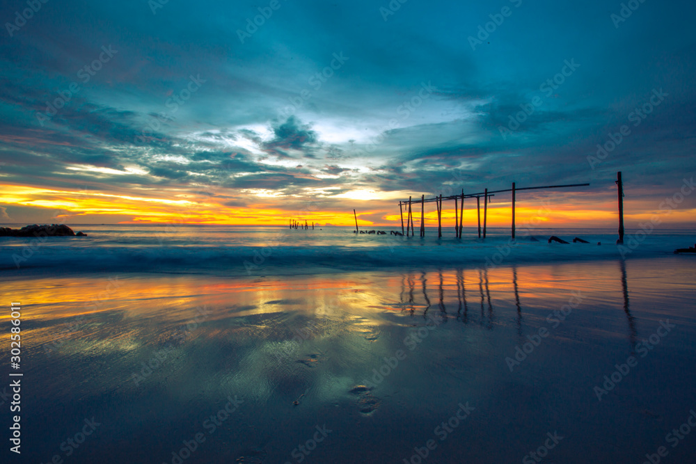 The background of a cloudy sky, colorful like a storm, and rain later, with blurring of wind and sea together, is a phenomenon that occurs naturally.