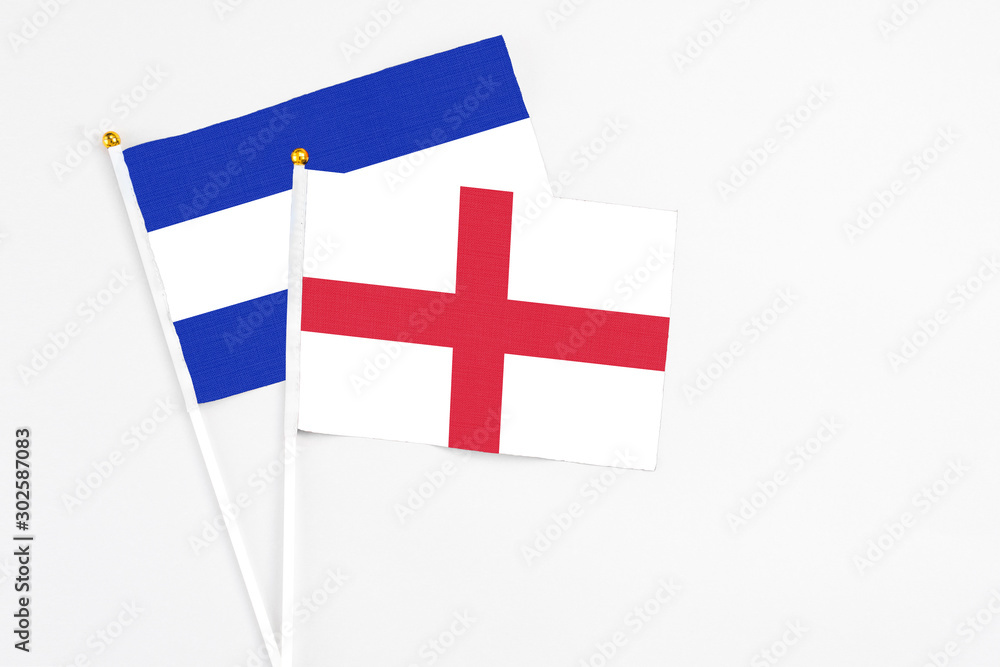 England and El Salvador stick flags on white background. High quality fabric, miniature national flag. Peaceful global concept.White floor for copy space.