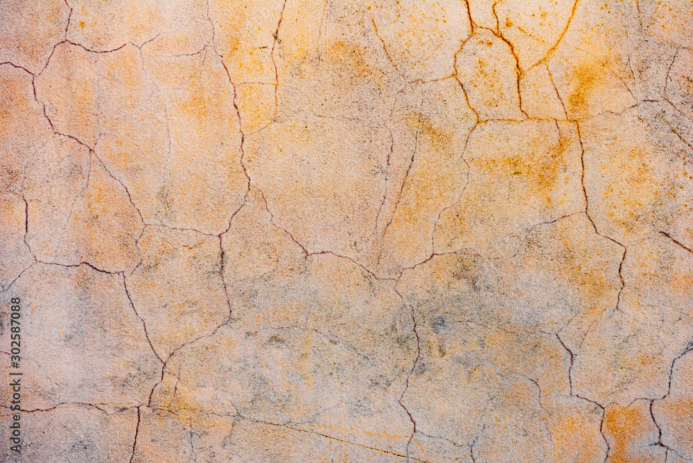 Texture of a concrete wall with cracks and scratches which can be used as a background Texture of a concrete wall with cracks and scratches which can be used as a background