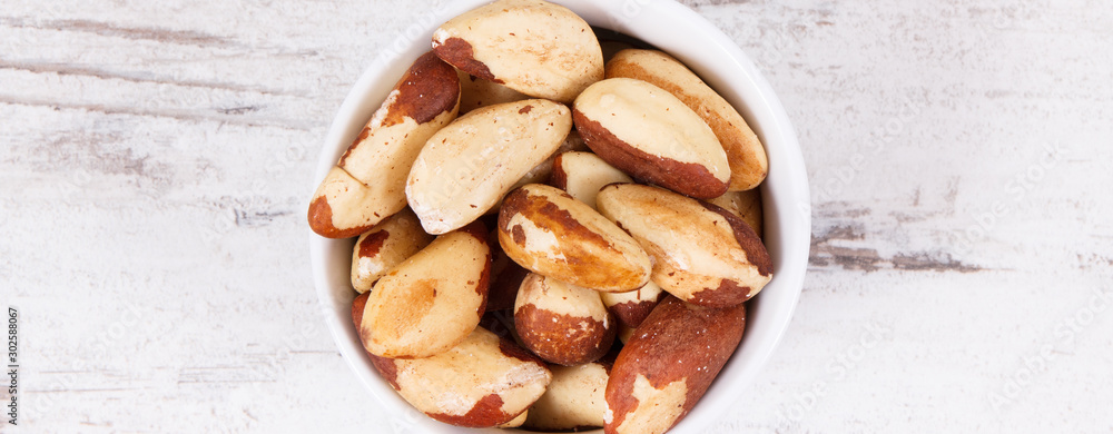 Brazil nuts containing natural minerals and vitamin, healthy nutrition concept