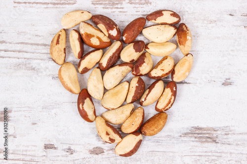 Heart shaped brazil nuts, concept of healthy natural minerals and vitamin in nutrition