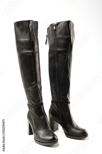 women's black leather high heeled boots isolated on white background