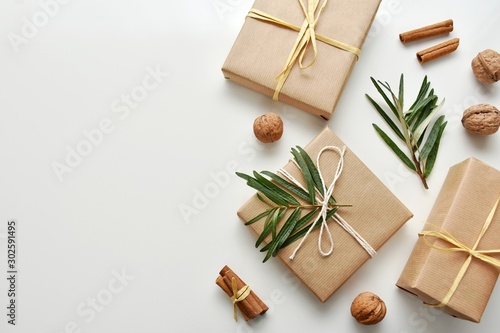 Zero waste gift wrapping with craft paper and natural decorations, top view, copy space.