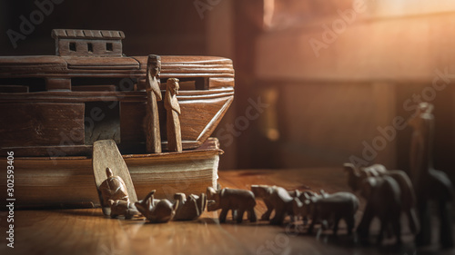 Konstfotografi Noah's Ark with animals entering before great flood, story in Bible, Wood carving doll, christian concept