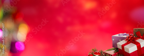 Gift packages in front of red bokeh lights background