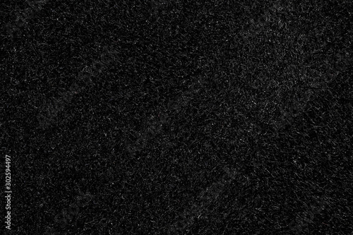 Black canvas or velvet paper texture. Closeup