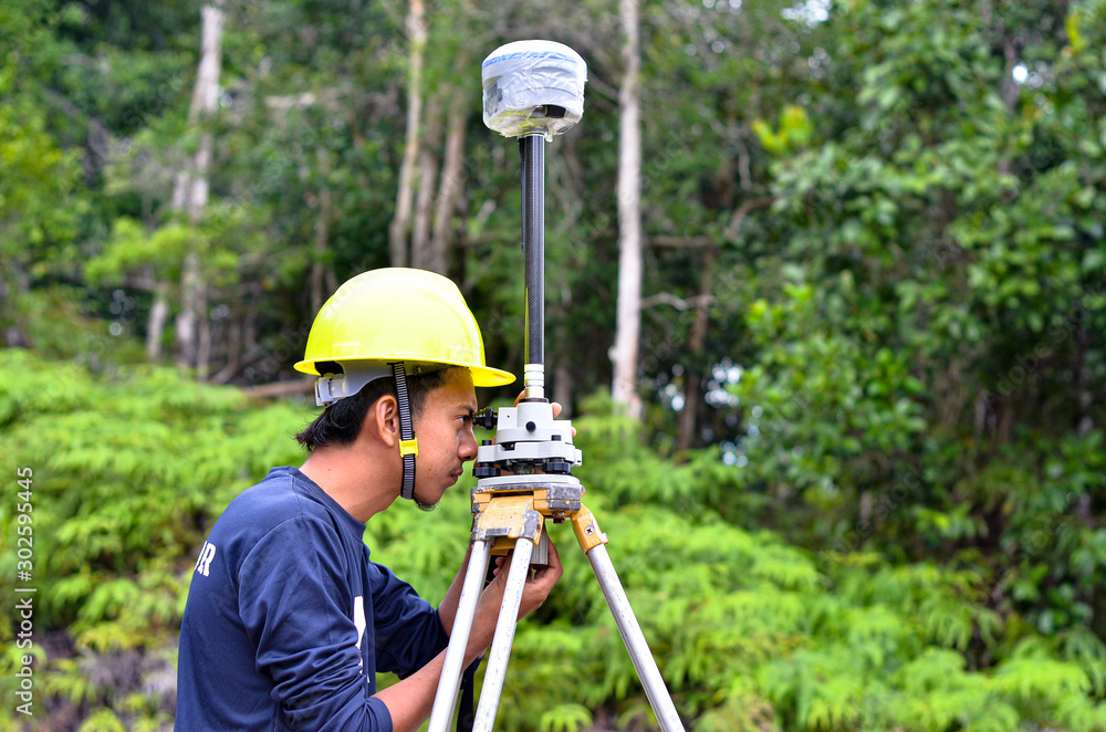 custom made wallpaper toronto digitalA close up of land surveyor looking at the tribrach to get it balance