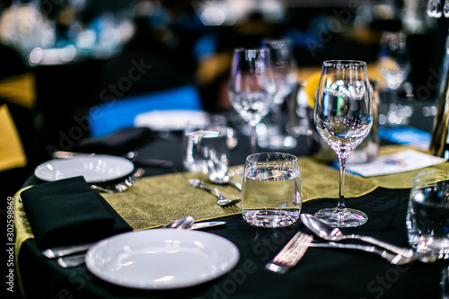 Glasses, plates and table decorations table evening restaurant dinner event