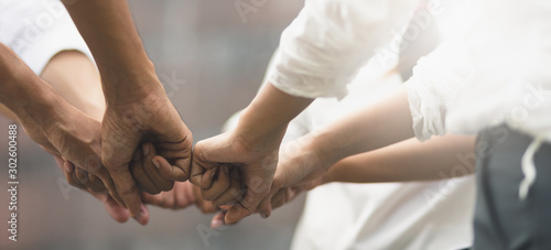 Panoramic teamwork business join hand together concept, Business team standing hands together, Volunteer charity work. People joining for cooperation success business.