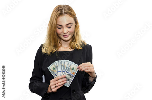 business woman with dollars on a white background looking at the camera.