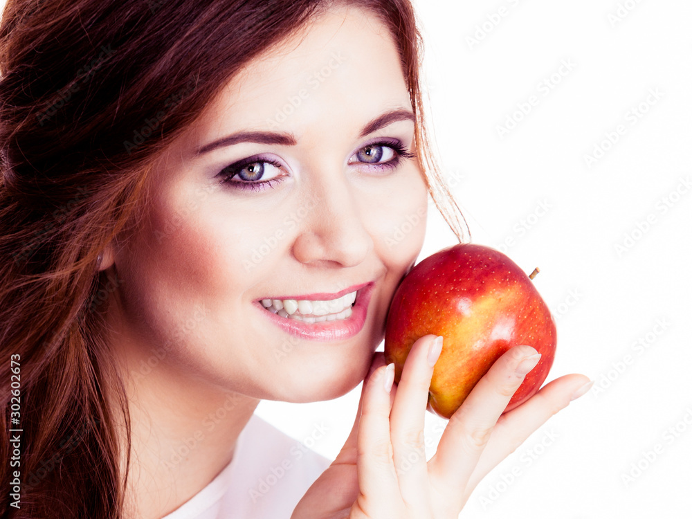 Woman holds apple fruit close to face, isolated Woman holds apple fruit close to face, isolated