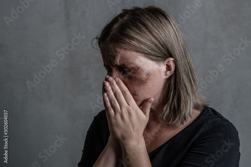 Crying woman victim of domestic violence and abuse