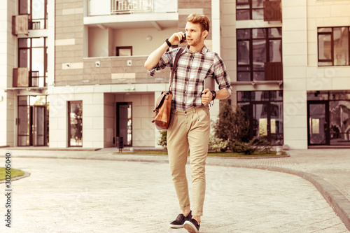 Attentive blonde man being in all ears during conversation photo