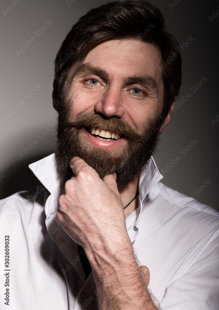 Portrait handsome bearded man, sexy guy on a dark background Portrait handsome bearded man, sexy guy on a dark background