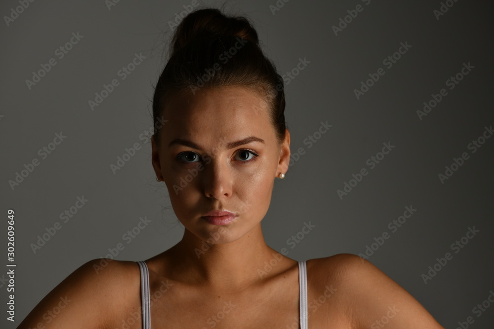 ballerina face close up on gray background ballerina face close up on gray background