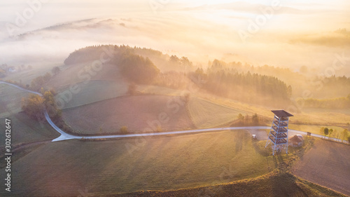 Look Out Tower in Brusnik, Ciezkowice. Polish Countryside at Sunrise photo