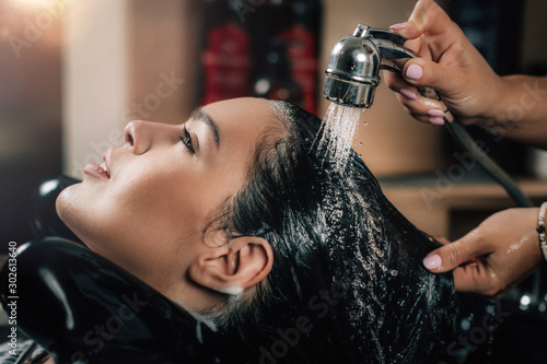 Young Woman Having Hair Washed in Salon