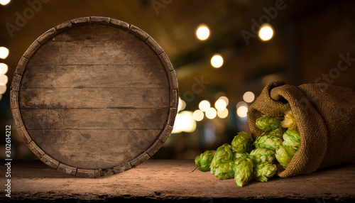 Quadro em tela Old wooden barrel on a brown background