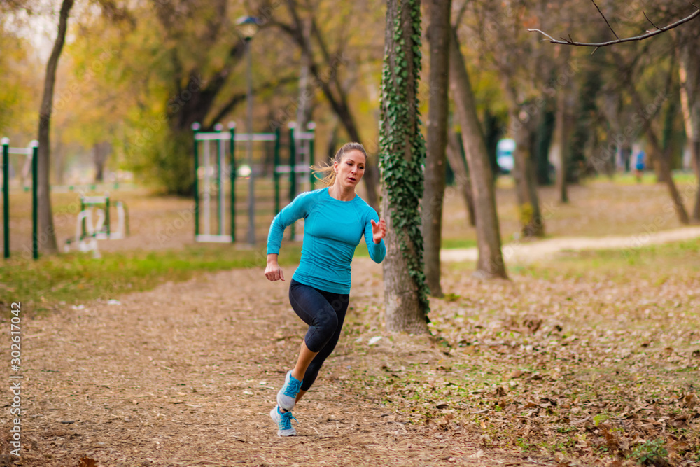 Jogging Outdoors. Attractive Woman, Park, Nature Jogging Outdoors. Attractive Woman, Park, Nature
