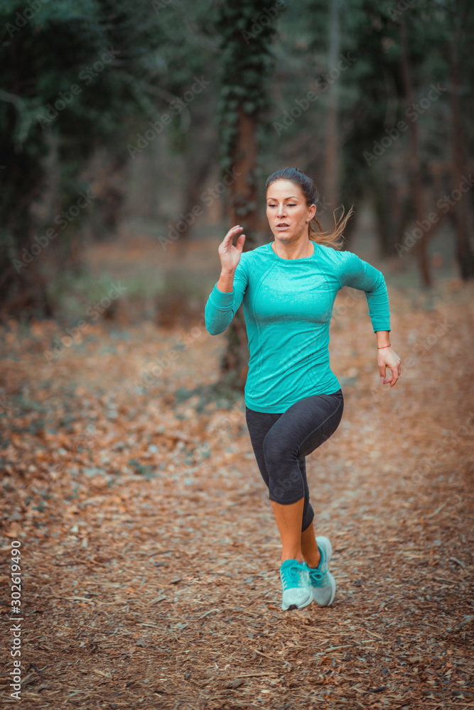 Woman Jogging Outdoors in the Park Woman Jogging Outdoors in the Park