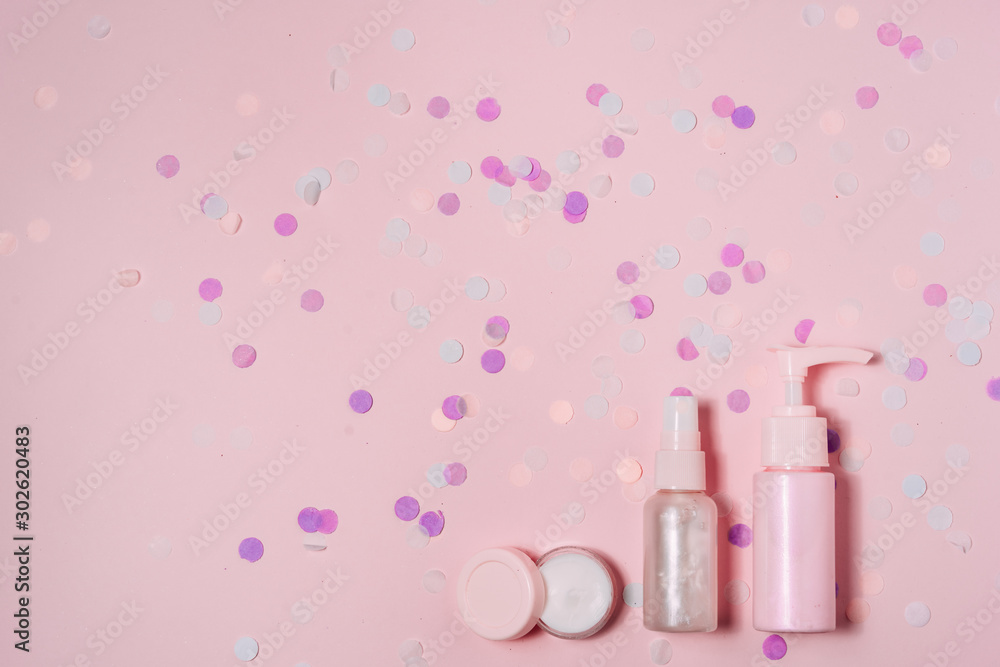 Cosmetic bottle containers on pink color background. Cosmetic bottle containers on pink color background.