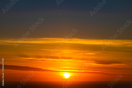 Beautiful and peaceful firey sunset or sunrise over the ocean. © Global News Art