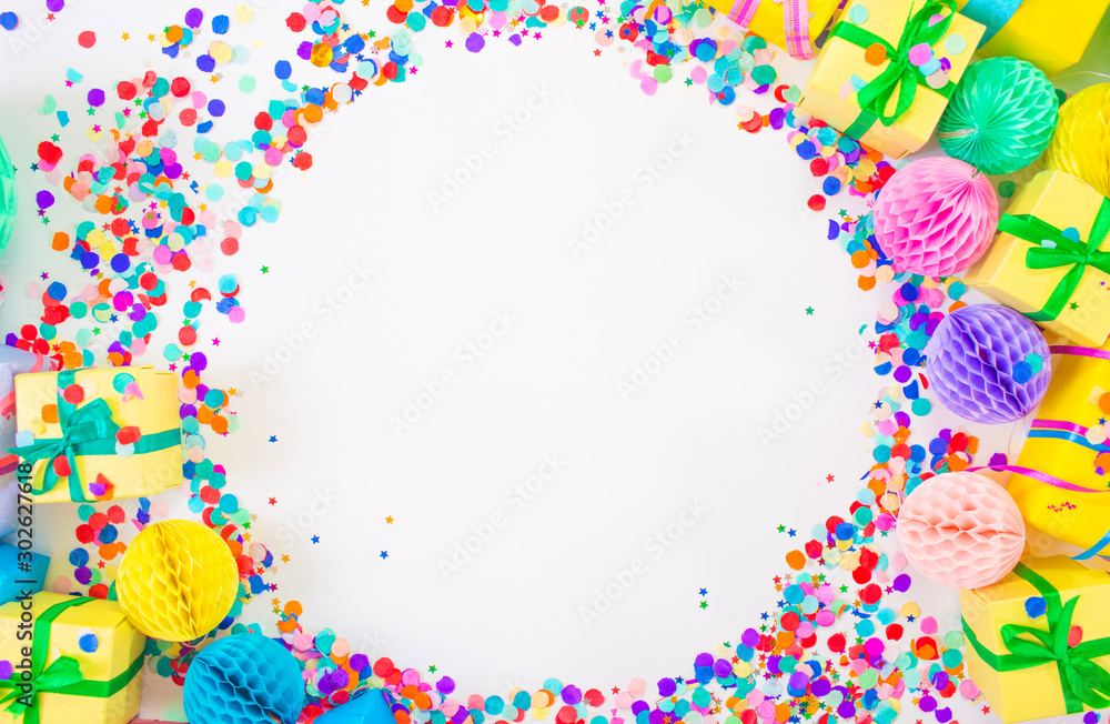 Confetti scattered in different colors on a white background. Festive confetti. The decor for the party Confetti scattered in different colors on a white background. Festive confetti. The decor for the party