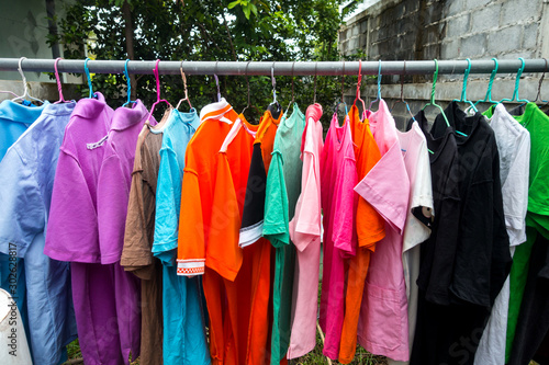 Multi colored Used Shirt with hangers.Dry clothes in hangers.