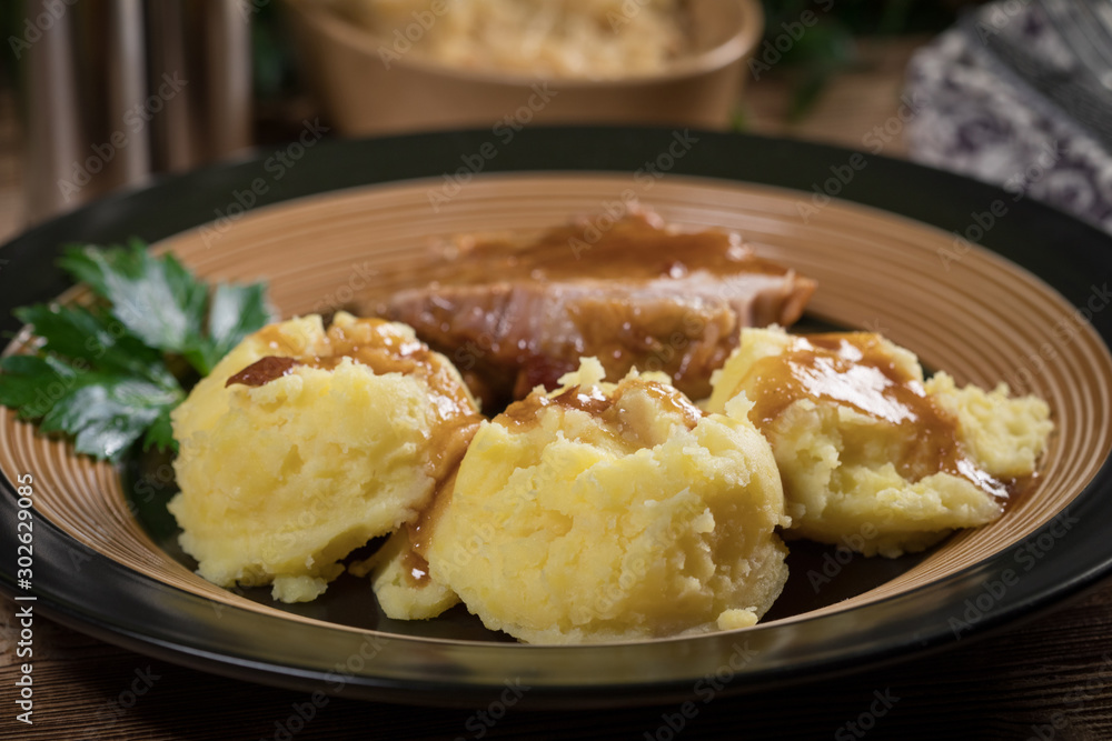Braised pork neck in own sauce. Shallow depth of field. Braised pork neck in own sauce. Shallow depth of field.
