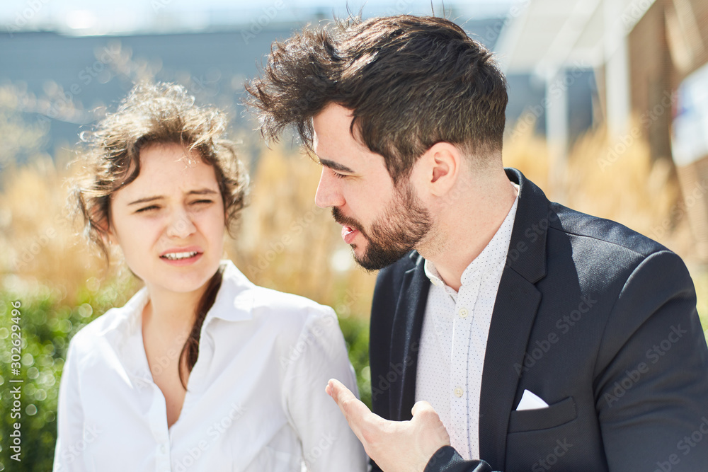 Two young business people as a team in dialogue Two young business people as a team in dialogue