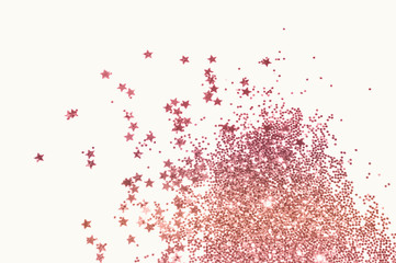 Pink glitter and glittering stars on light gray background