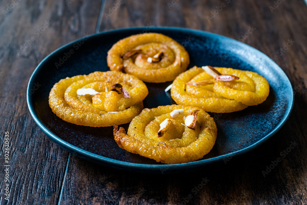 Jalebi or Jilbi or imarati, indian sweet food fried in pure ghee Gujarat Crispy Fafda. Jalebi or Jilbi or imarati, indian sweet food fried in pure ghee Gujarat Crispy Fafda.