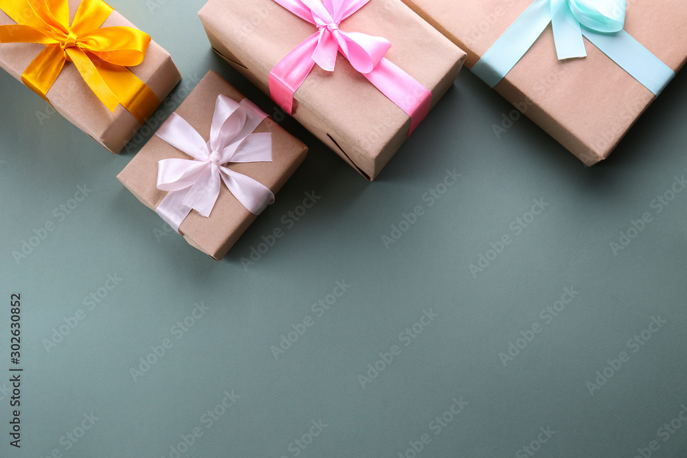 Simple composition with multiple presents wrapped in hand made blank craft paper gift wrap, pastel satin bow. Simple giftbox, wrapping, giftwrap, silk ribbon. Pink background, close up, copy space. Simple composition with multiple presents wrapped in hand made blank craft paper gift wrap, pastel satin bow. Simple giftbox, wrapping, giftwrap, silk ribbon. Pink background, close up, copy space.