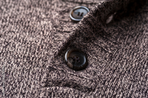 Close-up of a gray knitted warm jacket