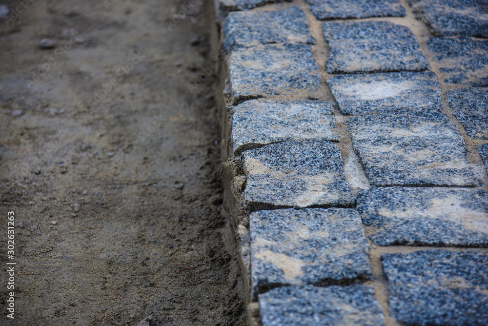 laying new granite paving stones laying new granite paving stones
