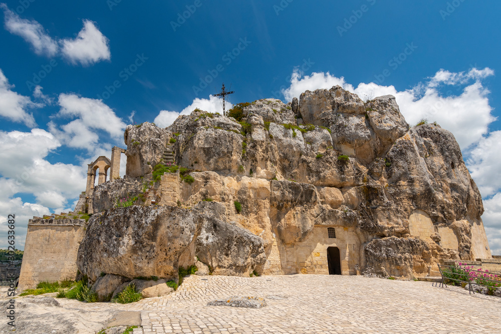 View of the church of Madonna de Idris ( Chiesa Rupestre di Santa Maria di Idris ) in the rock. Cave church in Sassi old town. Matera, Italy.
