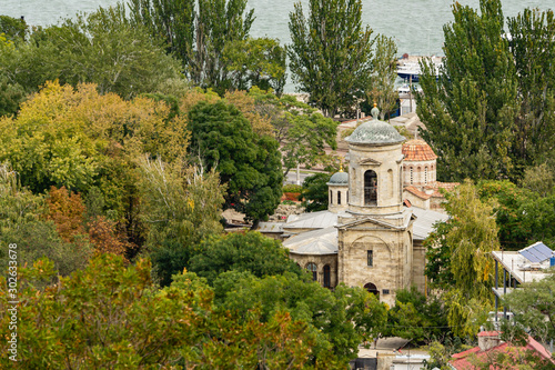 Kerch  Russia - September 25  2019  Church of St. John Baptist  built in 8th century. View of temple from top of Mount Mithridates. Close-up of bell tower of temple. Temple is built of Crimean stone.