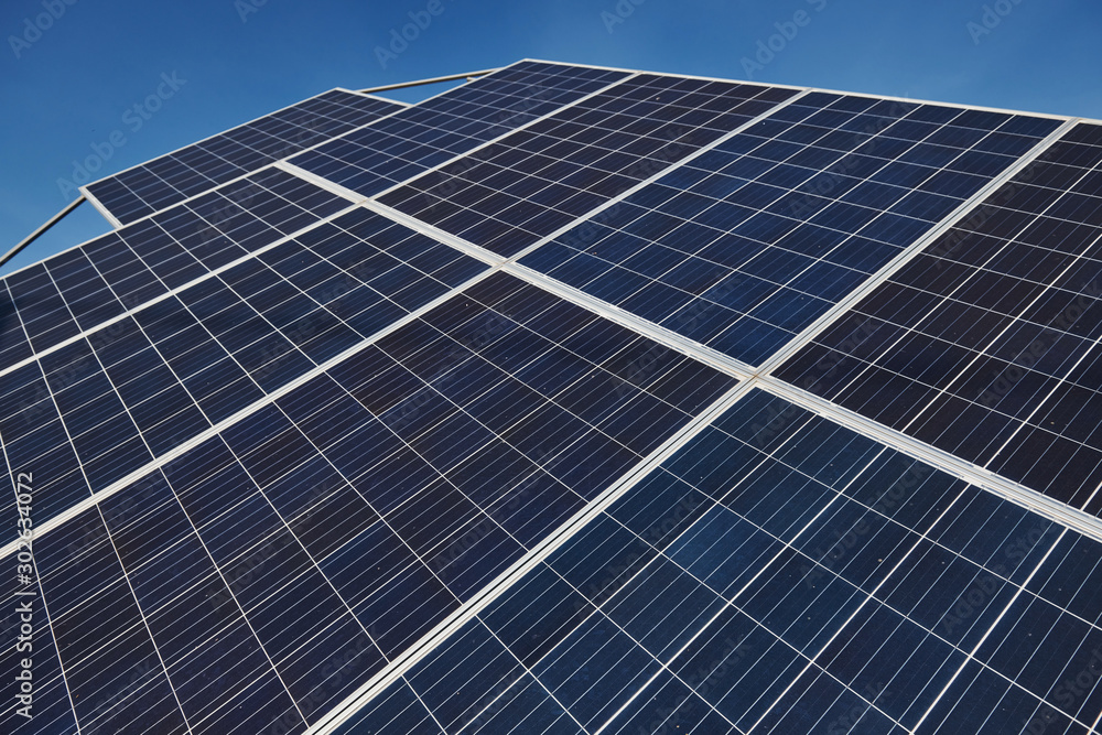 Close up view of polished surface of solar batteries at sunny daytime Close up view of polished surface of solar batteries at sunny daytime